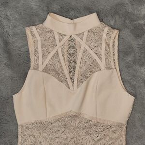 Blush pink lace bodysuit with high neckline and criss-cross back Size S